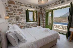 Postel nebo postele na pokoji v ubytování ARIS-APEA Villas