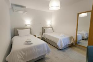 Postel nebo postele na pokoji v ubytování ARIS-APEA Villas