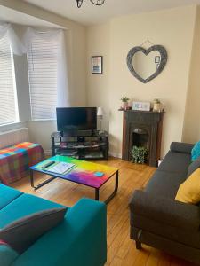 a living room with a couch and a coffee table at An Lar in Bellaghy