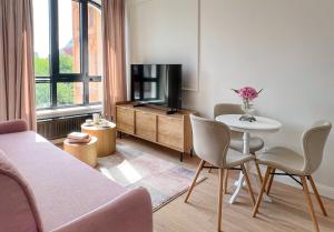 Telewizja i/lub zestaw kina domowego w obiekcie Kurkowa Apartments