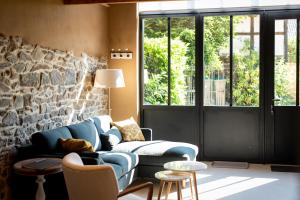 Posezení v ubytování Paddock Lodge - Suites Wellness & Chambres d'hôtes