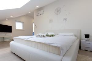 Säng eller sängar i ett rum på Apartment Alius Ragusa Deluxe