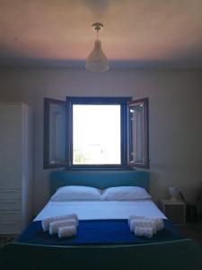 Katil atau katil-katil dalam bilik di Open Space a due passi dal mare