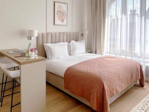 Łóżko lub łóżka w pokoju w obiekcie Kurkowa Apartments