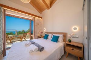 Ένα ή περισσότερα κρεβάτια σε δωμάτιο στο Pithari Sunset Villa +30 φωτογραφίες