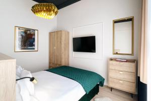 Łóżko lub łóżka w pokoju w obiekcie Kurkowa Apartments