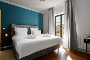 Llit o llits en una habitació de Hotel Waren-Alte Warener Zeitung