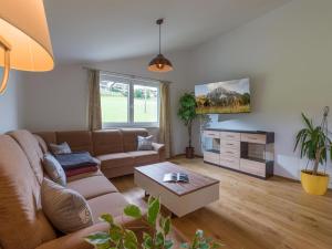 a living room with a couch and a table at Going EASY in Going