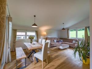 a living room with a table and a couch at Going EASY in Going