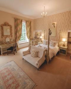 a bedroom with a bed and a couch at Breedon Hall in Derby