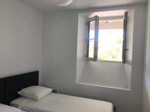 Posteľ alebo postele v izbe v ubytovaní Cannes 2 pieces de 49 m2 ,piscine. Jardin privatif