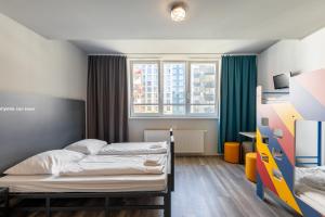 Postel nebo postele na pokoji v ubytování a&o Wien Hauptbahnhof