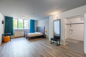 Postel nebo postele na pokoji v ubytování a&o Wien Hauptbahnhof