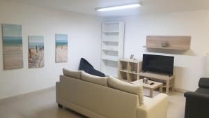 TV a/nebo společenská místnost v ubytování Apartamento Málaga, en El Palo
