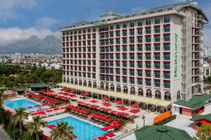 an aerial view of a hotel with a pool and tables at Megasaray Westbeach Antalya in Antalya