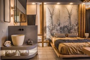 een slaapkamer met een bed en een muurschildering bij Avithos Resort Hotel in Svoronata