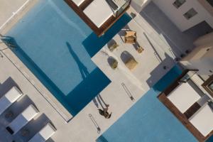 an overhead view of a swimming pool at Borosso Villa, an Exclusive Resort, By ThinkVilla in Skaleta