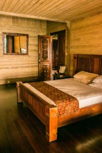 a bedroom with a large bed in a room at Imaj Private Villas in Senggigi 