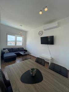 a living room with a couch and a table at A&A Apartments by the sea in Trogir