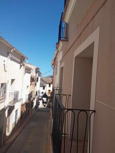 an empty alley in a building with a balcony at Can Perles casa rural in Tárbena
