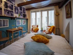 a bedroom with a large bed with two pillows on it at Romantic nest under Prague Castle in Prague