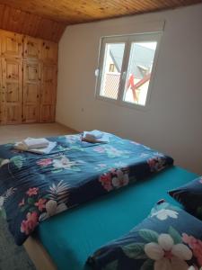 Postel nebo postele na pokoji v ubytování Apartman DoM