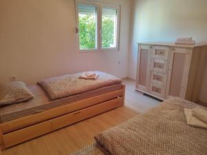 Postel nebo postele na pokoji v ubytování Apartman DoM