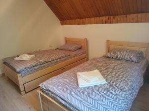 Postel nebo postele na pokoji v ubytování Apartman DoM