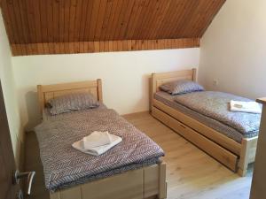 Postel nebo postele na pokoji v ubytování Apartman DoM