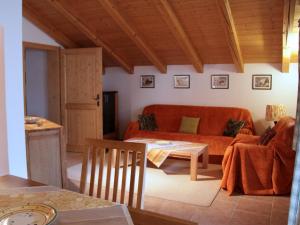 a living room with a couch and a table at Stöcklhof - Ferienwohnung in Rottau