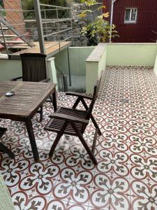 a patio with two chairs and a table on a tile floor at Bosphorus Bridge in Istanbul