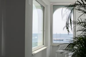 a window with a view of the ocean at Palazzo Don Salvatore in Amalfi