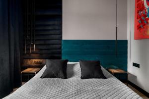 Posteľ alebo postele v izbe v ubytovaní Niegaleria Apartament
