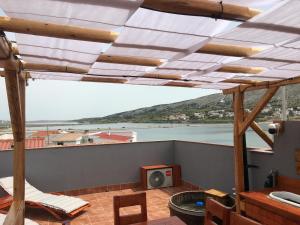 a view of a balcony with a view of a river at 4REST VILA in Pag