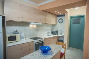 Kuchyň nebo kuchyňský kout v ubytování A Central Apartment