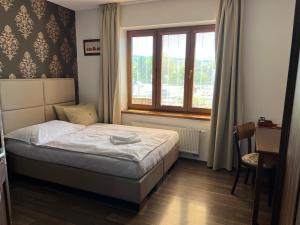 Posteľ alebo postele v izbe v ubytovaní Penzion Trattoria + 37 fotografií