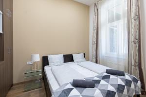 A bed or beds in a room at A37 Awesome Apartments