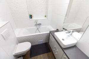 A bathroom at A37 Awesome Apartments
