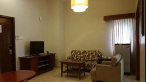 A seating area at Garden View Pulai Springs Resort