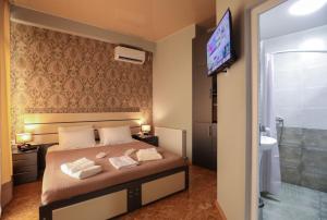 Voodi või voodid majutusasutuse Hotel Sagu toas