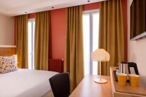 Postel nebo postele na pokoji v ubytování Hotel Elysees 8