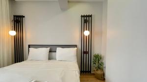 Postel nebo postele na pokoji v ubytování Ora Bella Hotel