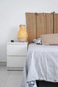 Ein Bett oder Betten in einem Zimmer der Unterkunft Le Family Palms My Home