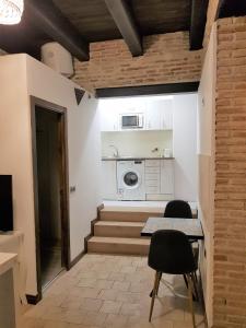 Kuchyňa alebo kuchynka v ubytovaní Apartamentos Alcantara