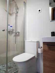Kúpeľňa v ubytovaní Apartamentos Alcantara