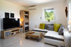 Televisyen dan/atau pusat hiburan di Ferienhaus Nera