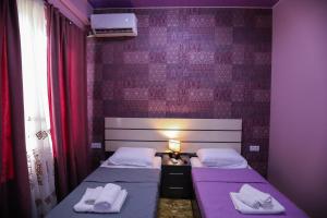 Voodi või voodid majutusasutuse Hotel Sagu toas