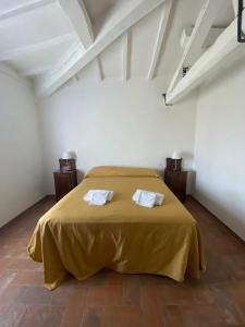 Posteľ alebo postele v izbe v ubytovaní Agriturismo Diffuso Monte Oliveto Maggiore