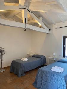 Posteľ alebo postele v izbe v ubytovaní Agriturismo Diffuso Monte Oliveto Maggiore