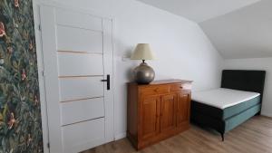 Łóżko lub łóżka w pokoju w obiekcie Apartamenty 8 i 10 osobowe Koniakówka Resort